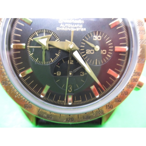 104 - An 18ct gold cased Omega Speedmaster automatic chronometer watch, with box and paperwork, dated 2002... 