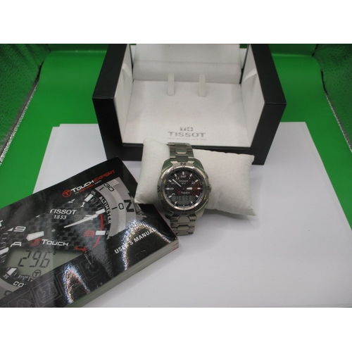 107 - A Tissot touch expert smart watch with original titanium strap, in full working order with box and i... 