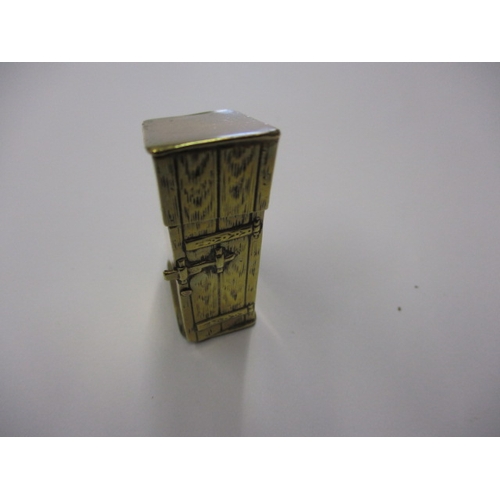 291 - An antique brass novelty vesta case, in the form of a toilet, approx. height 5cm, having general age... 