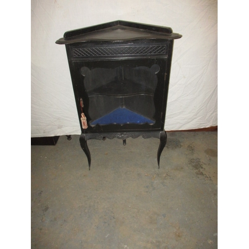 345 - A vintage ebonised floor standing glazed door corner cabinet, in good used condition, approx. height... 