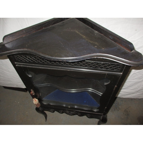 345 - A vintage ebonised floor standing glazed door corner cabinet, in good used condition, approx. height... 