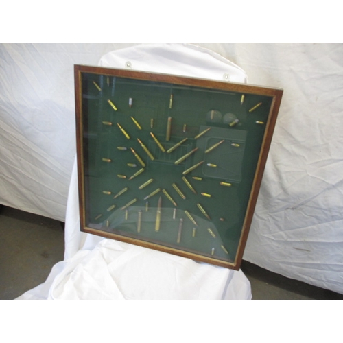 370 - A glazed wall mounted display of rifle bullets, various types, all spend condition, approx. case siz... 