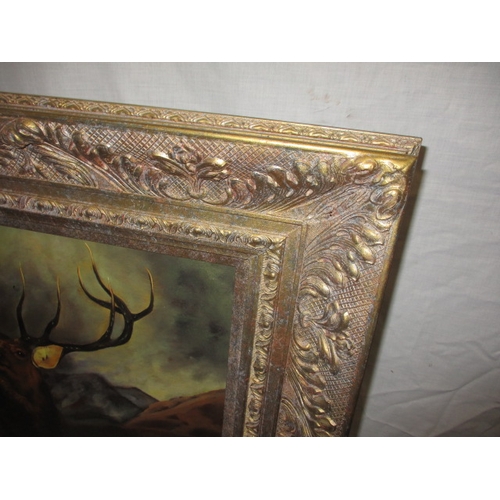 357 - A gilt framed oil on board painting of a stag, approx. frame size 85x75cm, signed lower right, in go... 