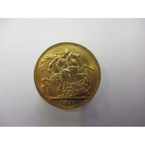 238 - A George V gold sovereign dated 1911, a circulated coin with fine definition of features