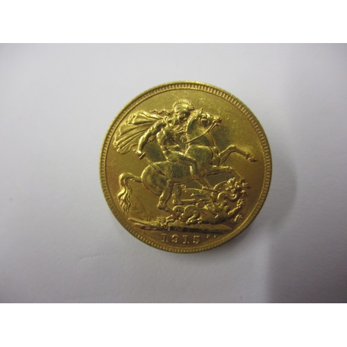 239 - A George V gold sovereign dated 1915, a circulated coin with fine definition of features