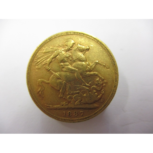 241 - A Victorian gold sovereign dated 1887, a circulated coin with fine definition of features