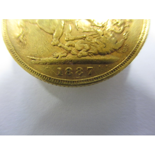 241 - A Victorian gold sovereign dated 1887, a circulated coin with fine definition of features