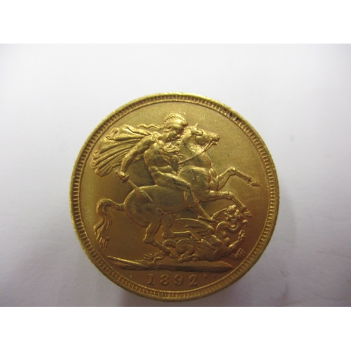 242 - A Victorian gold sovereign dated 1892, a circulated coin with fine definition of features