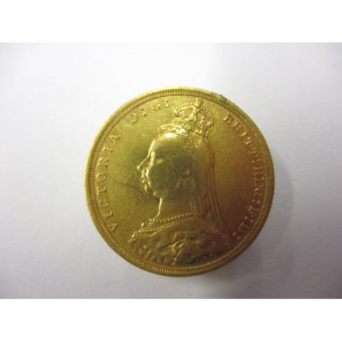 243 - A Victorian gold sovereign dated 1889, a circulated coin with fine definition of features