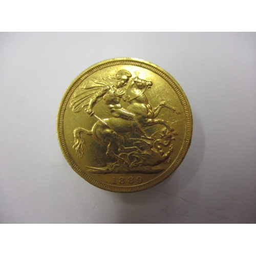 243 - A Victorian gold sovereign dated 1889, a circulated coin with fine definition of features