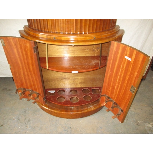 349 - A mid 20th century art deco drinks cabinet by Rivington, having walnut veneer,  mirrored interior, i... 