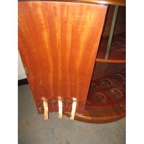 349 - A mid 20th century art deco drinks cabinet by Rivington, having walnut veneer,  mirrored interior, i... 