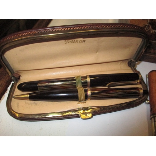 294 - A quantity of vintage fountain pens and an inlaid stationary box, to include examples by Sheaffer, P... 