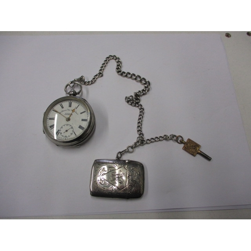 97 - A silver cased pocket watch, with silver Albert chain and vesta case, watch runs when wound, cracked... 