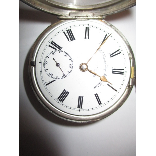 97 - A silver cased pocket watch, with silver Albert chain and vesta case, watch runs when wound, cracked... 