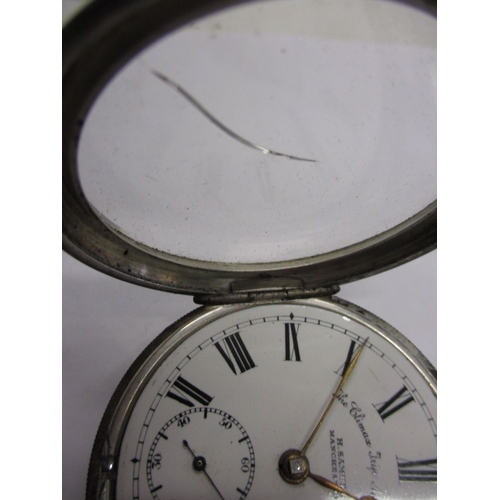 97 - A silver cased pocket watch, with silver Albert chain and vesta case, watch runs when wound, cracked... 