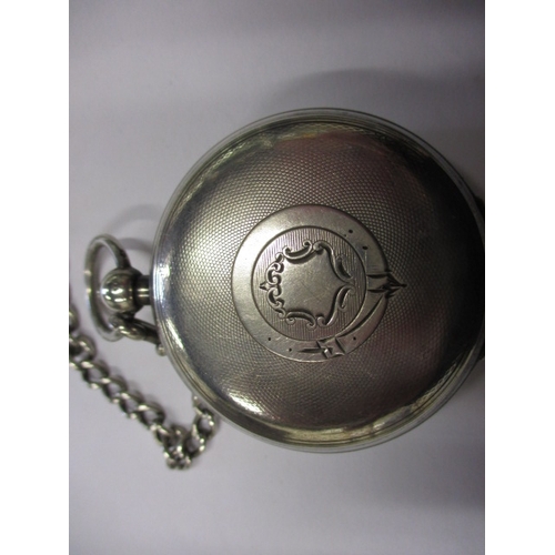 97 - A silver cased pocket watch, with silver Albert chain and vesta case, watch runs when wound, cracked... 