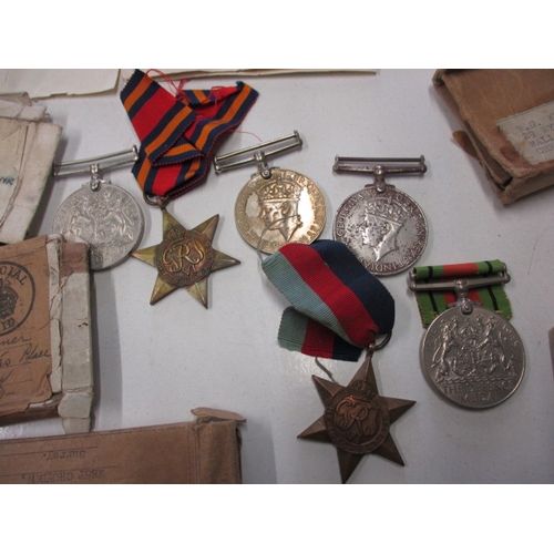 307 - Small parcel of original WW2 British military medals, empty boxes of issue and entitlement slips, al... 