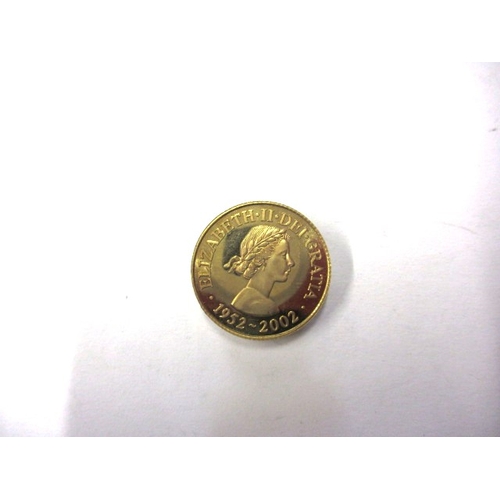 246 - A 9ct gold commemorative coin for the Queens golden jubilee dated 2002, approx. weight 7g in uncircu... 