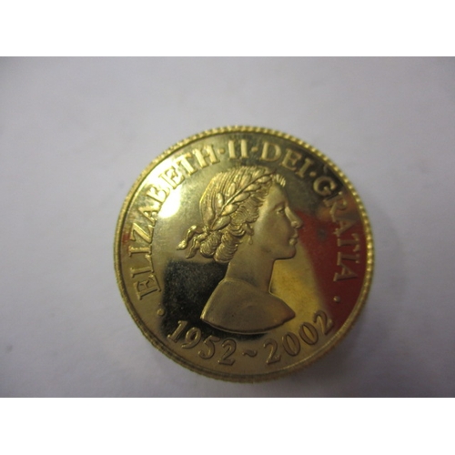 246 - A 9ct gold commemorative coin for the Queens golden jubilee dated 2002, approx. weight 7g in uncircu... 