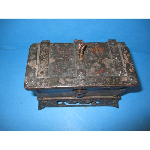 267 - A small armada style money box, with working lock, approx. size W, 17cm H, 12cm D, 10cm, having gene... 