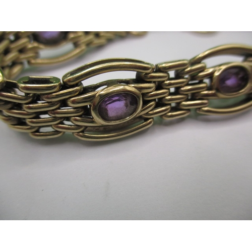 81 - A 9ct yellow gold bracelet, with central band of amethyst , approx. gross weight 24.5g, in useable p... 