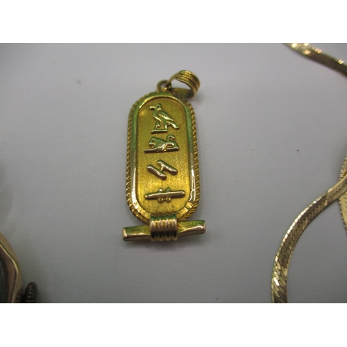 83 - A parcel of gold jewellery items, to include an Egyptian pendant and a watch, some damages