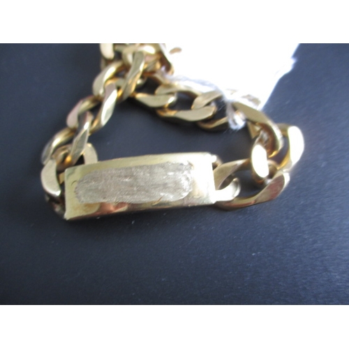 84 - An 18ct yellow gold identity bracelet, inscription obscured, so classed as damaged, approx. length 2... 