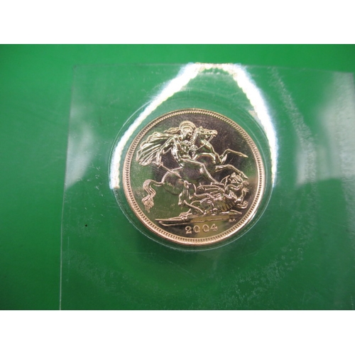 249 - An uncirculated gold sovereign, dated 2004 in Royal Mint vacuum sealed package