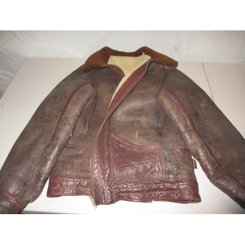 17 - A 1950s leather flying jacket, non-military type, in  used condition with working zip