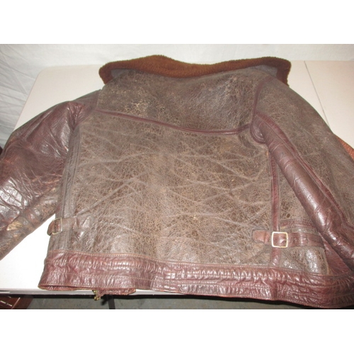 17 - A 1950s leather flying jacket, non-military type, in  used condition with working zip