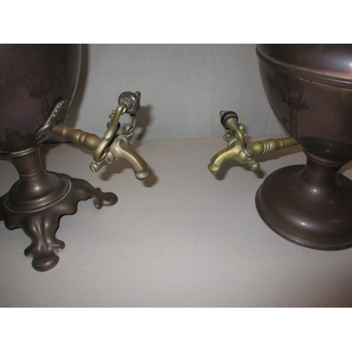 20 - Two vintage hot water urns, well tarnished with general use-related marks