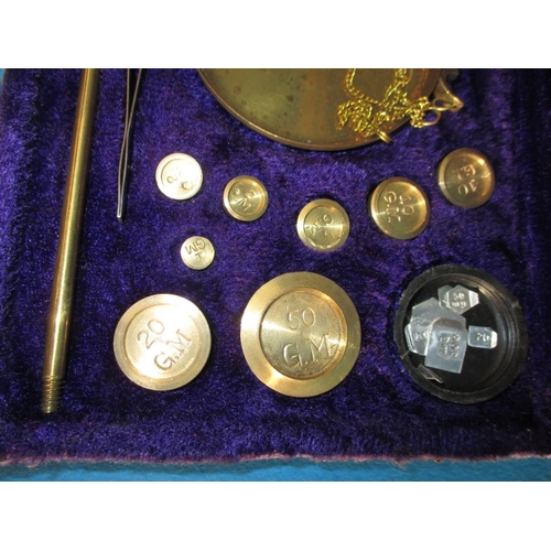 21 - A boxed set of portable balance scales, in fitted case with complete set of weights, previous proper... 