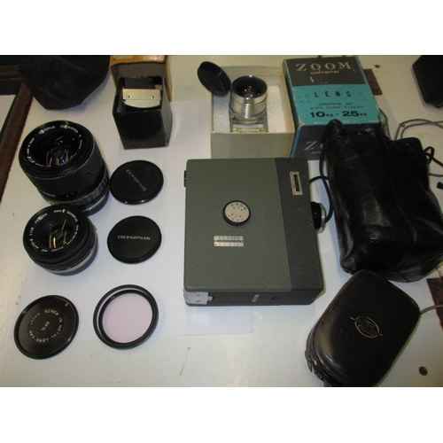 23 - A parcel of photography accessories, to include Olympus lenses, all in used condition