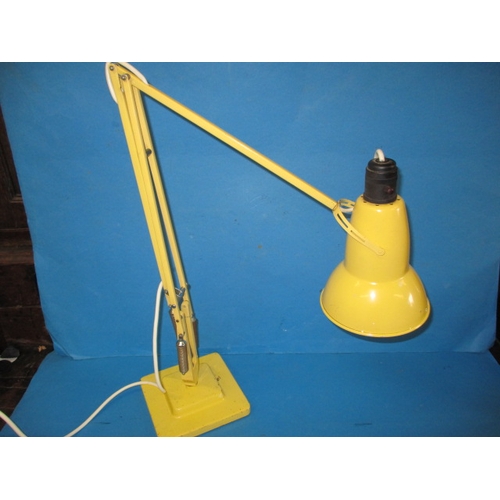 A vintage Herbert Terry Anglepoise lamp, in original yellow finish, having general use-related marks