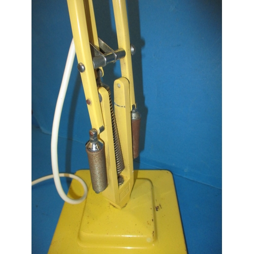 24 - A vintage Herbert Terry Anglepoise lamp, in original yellow finish, having general use-related marks