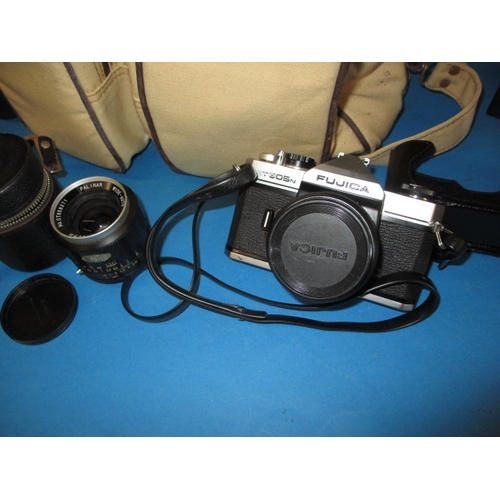 26 - A vintage camera and accessories, in used condition and not tested as to function