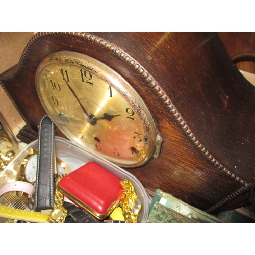 31 - A quantity of general clearance items, to include watches and a clock, all in used condition