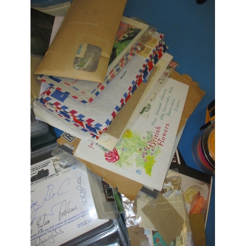 42 - A large quantity of vintage postcards and first day cover stamps, all in used condition