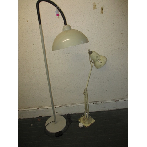 49 - A vintage Terrys angle poise lamp and an adjustable head floor standing lamp, both in used pre-owned... 