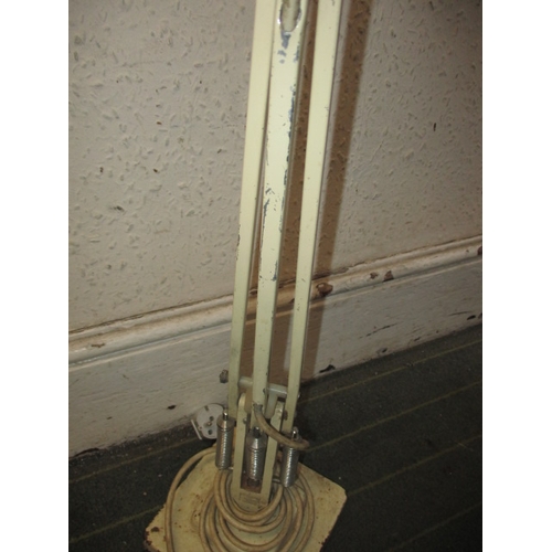 49 - A vintage Terrys angle poise lamp and an adjustable head floor standing lamp, both in used pre-owned... 