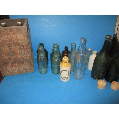 51 - A quantity of vintage glass and stoneware bottles, to include examples from Foxearth, Norwich and Bu... 