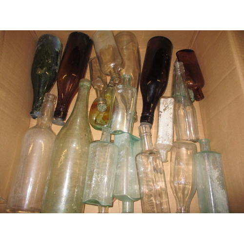 51 - A quantity of vintage glass and stoneware bottles, to include examples from Foxearth, Norwich and Bu... 