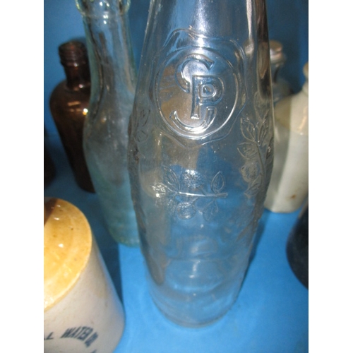 51 - A quantity of vintage glass and stoneware bottles, to include examples from Foxearth, Norwich and Bu... 