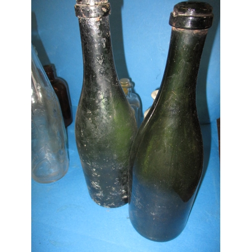 51 - A quantity of vintage glass and stoneware bottles, to include examples from Foxearth, Norwich and Bu... 