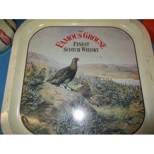 53 - A quantity of vintage tins, to include a hat box and pub tray, all in used condition