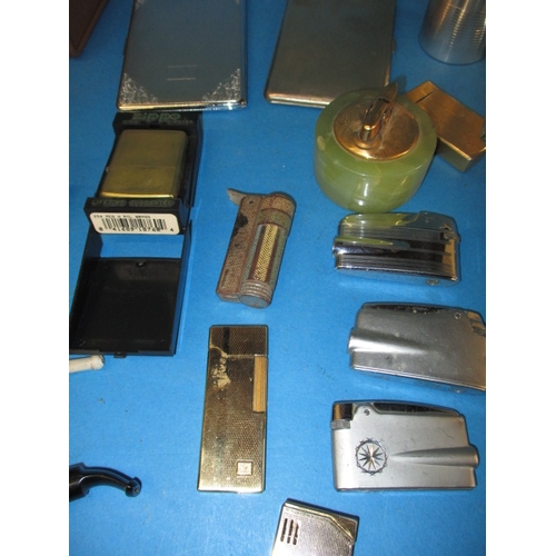 54 - A parcel of smoking related items, to include lighters, pipes and ashtrays, all in used condition