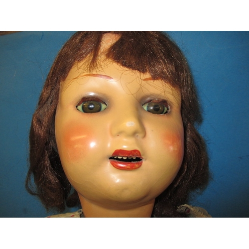 61 - A large 1930s composite doll, approx. height 89cm, some fingers missing from left hand and general a... 