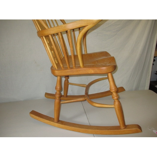 65 - A hardwood rocking chair, makers mark for C J Marsterson in good pre-owned condition