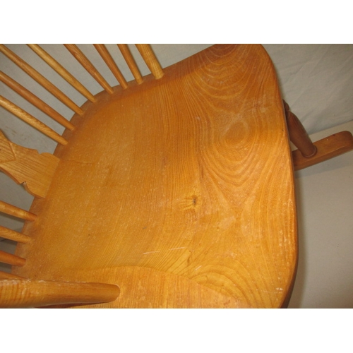 65 - A hardwood rocking chair, makers mark for C J Marsterson in good pre-owned condition